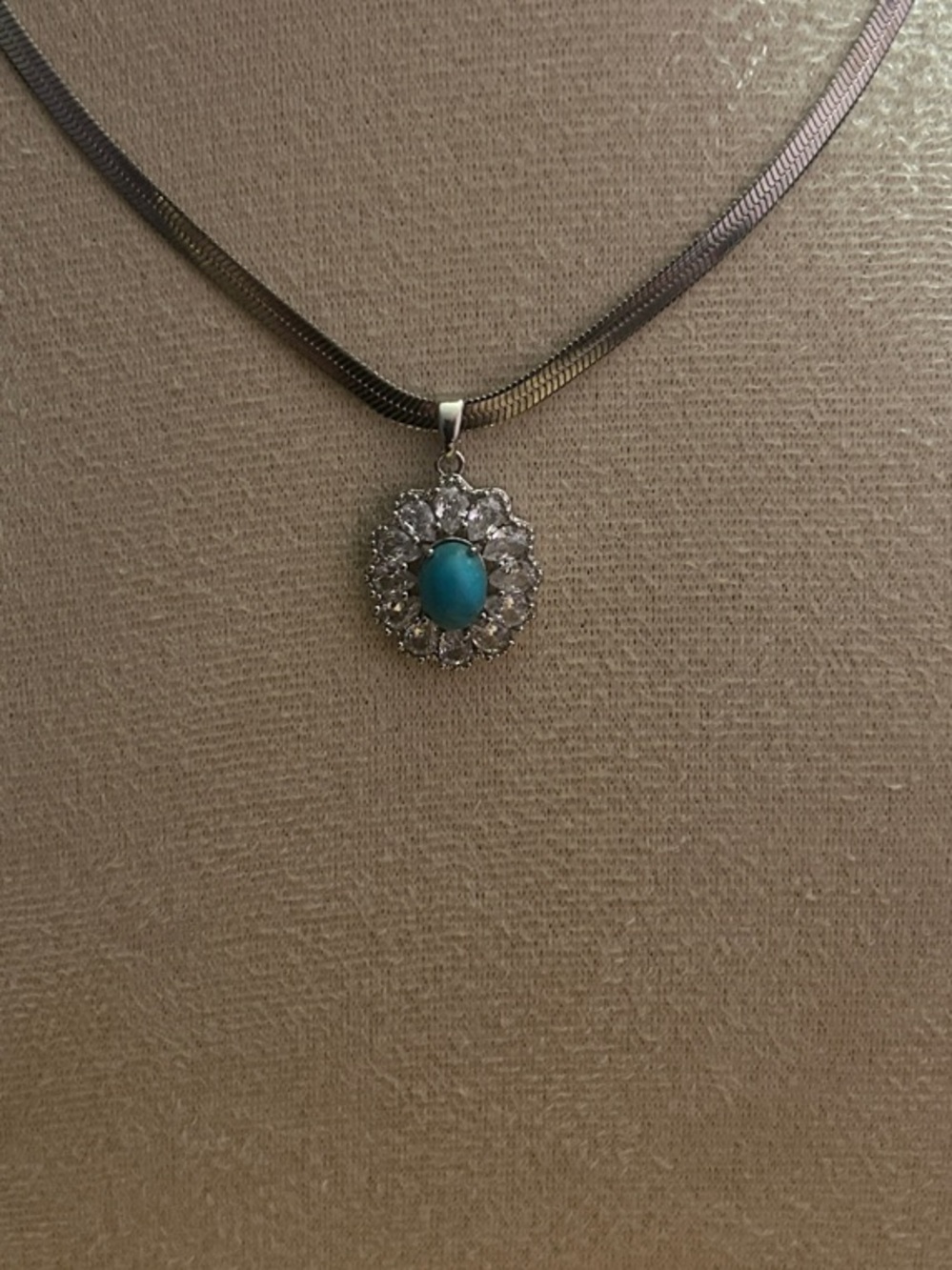 Genuine Turquoise Pendant in a Halo Setting Surrounded by Tear Drop CZ Stones